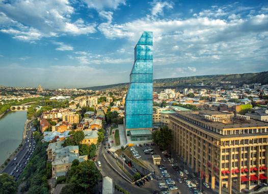 A glass tower in the middle of the historical district of Tbilisi